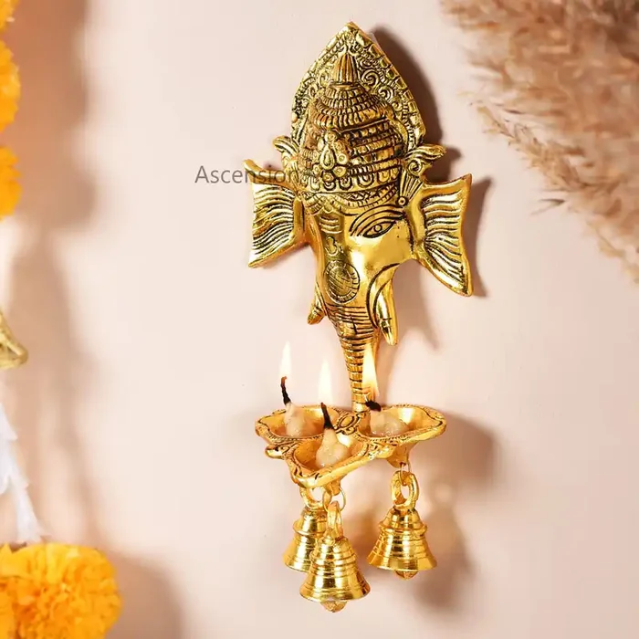 Ascension Ganesh Ji Wall Hanging with Three Diya‘s and Bells Lord Shree Ganesha Face Sculpture For Home,Office, Pooja Room, Diwali Gift Religious Item Decorative Showpiece Metal Hanging Diyas Oil Lamp